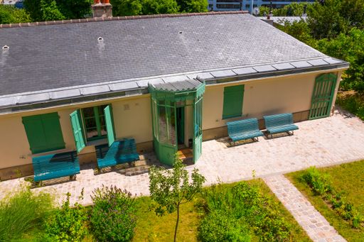 View Of Maison de Balzac With Benches And Door Gate. Writer's House Museum In Paris, France