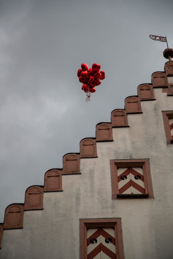 A beautiful architectural details of a tower against a grey sky