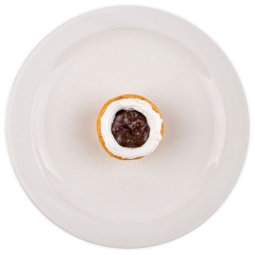 A top view of a creamy cookie with a jam inside served on a white plate isolated on a white background