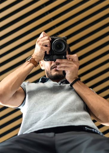 Abstract portrait of a photographer on a wooden background
