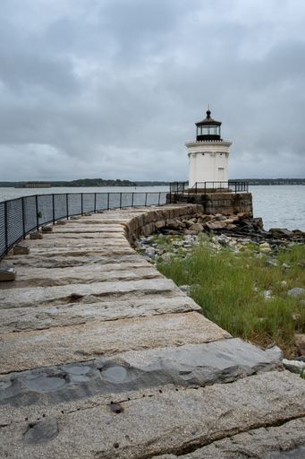 A Portland breakwater lighthouse at Bug Light Park on a gloomy day