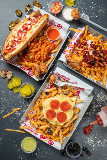 A vertical top view of various fast food on a table