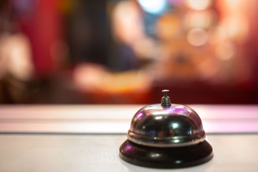 Reception or service bell with a shiny metal surface on a reception desk