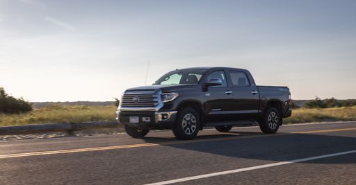 Toyota pickup truck driving on a beach road in Marthas Vineyard