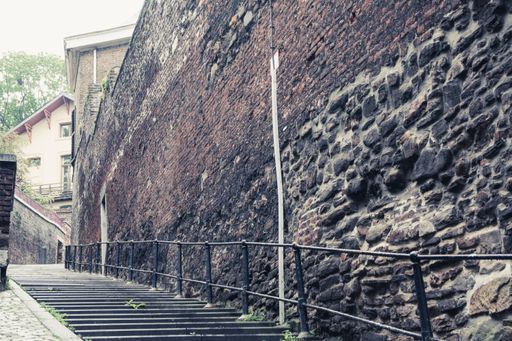 A view of Stairs of Rue Peri public area and an old wall in Liege, Belgium