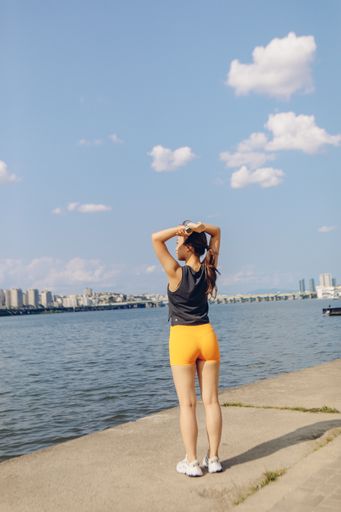 A young East Asian female doing her early morning jogging and workout outdoors, South Korea