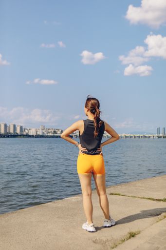 A young East Asian female doing her early morning jogging and workout outdoors, South Korea
