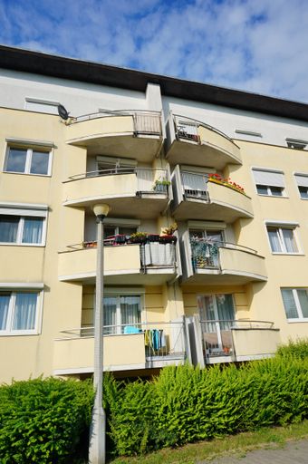 A vertical shot of an apartment building with balconies in the Stare Zegrze district of Poznan, Poland