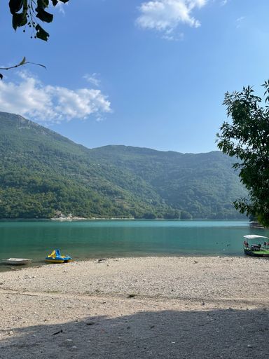A vertical shot of a beautiful view of the sea and mountains in Bosnia and Herzegovina