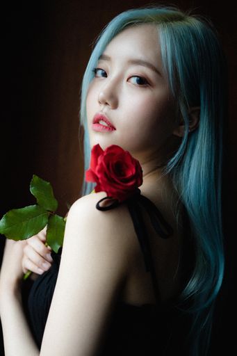 A beautiful blue-haired South Korean female with a single red rose