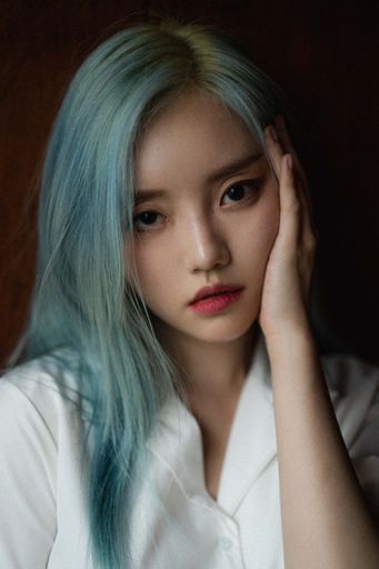 A portrait of a beautiful young blue-haired South Korean female