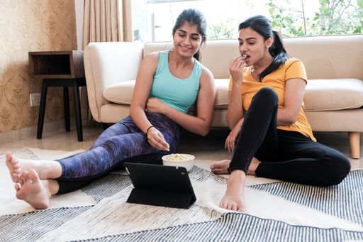 A closeup of two girls relaxing after the workout.