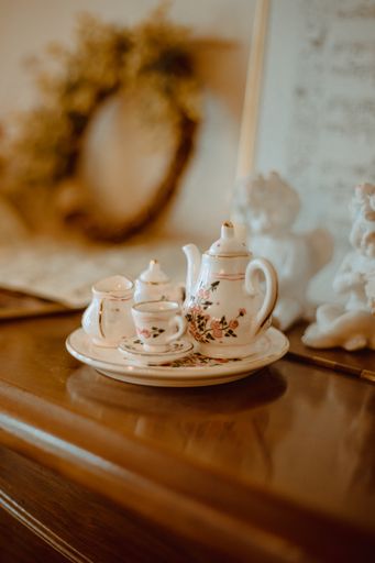 A vertical shot of beautiful vintage decorated floral porcelain coffee serving set