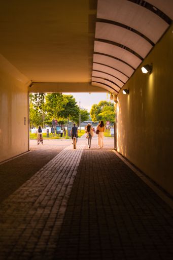 A vertical shot of people walking through a tunnel in South Korea