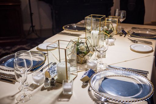 A high angle shot of a luxurious setting of a dining table