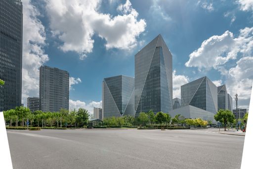 Empty street in downtown of a modern city with office buildings