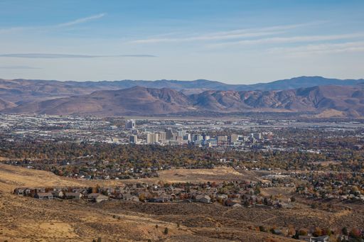 An elevated wide angle view of Reno, Nevada and the Washoe County skyline, including residential neighborhoods, as seen from the northwest hills.