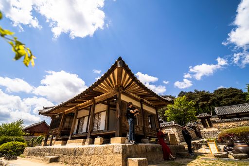 A low angle shot of a landscape with traditional building in Hahoe Folk Village in South Korea
