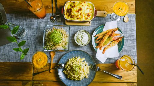 A top view of a healthy vegetarian dinner table for two