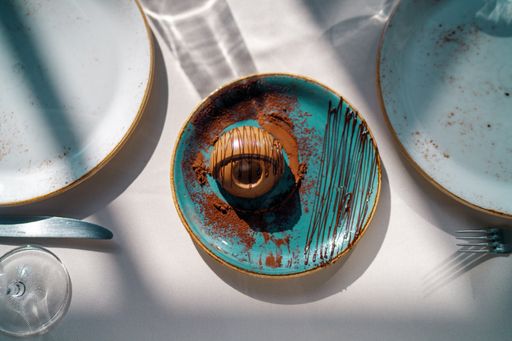A top view of a chocolate dessert on a blue plate