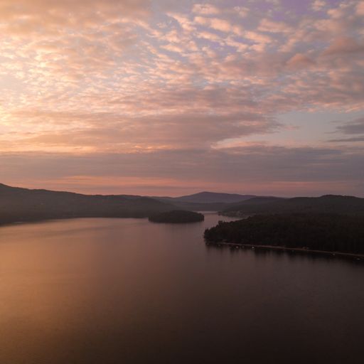 A beautiful pink sunset over the water and nature in New England