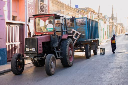 A tractor with a cart as a garbage truck in Matanzas, Cuba