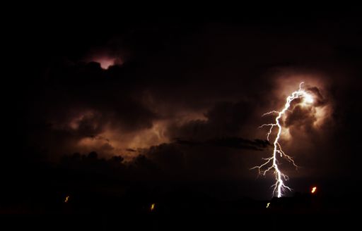 A beautiful shot of a lightning strike in the cloudy night sky