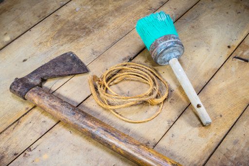 A closeup shot of old rustic tools on a wooden surface
