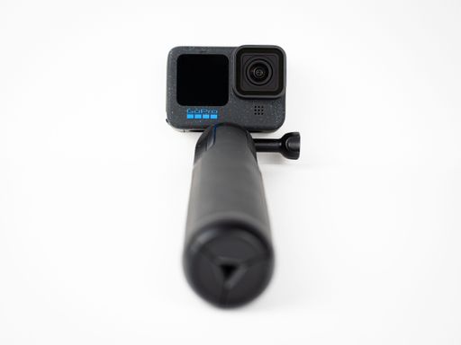 A GoPro 12 Black action camera isolated on a white background