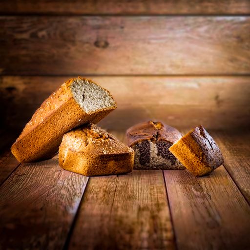 A still life of regular and chocolate bread on a wooden background