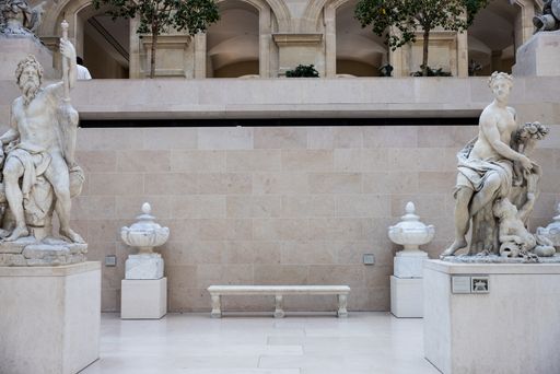 The sculptures inside of Louvre museum in Paris, France