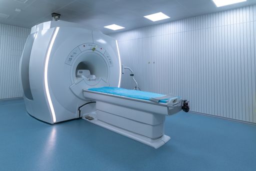 A closeup of a high end Magnetic Resonance Imaging scanner in a bright room