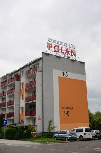 A vertical of a five-storey apartment building in Poznan , Poland