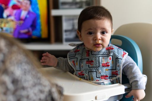 A cute Hispanic child on a baby walker