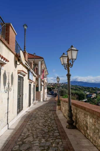 A narrow street among the old houses of a medieval village in the province of Latina.