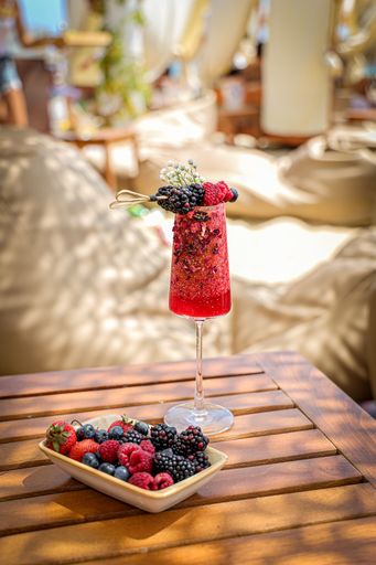 A closeup shot of lemonade with berries and berries in the bowl on the table