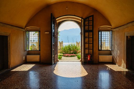 An open door of an entrance door leading to the yard