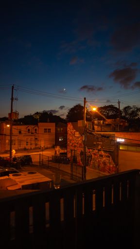 A night view of houses from a balcony