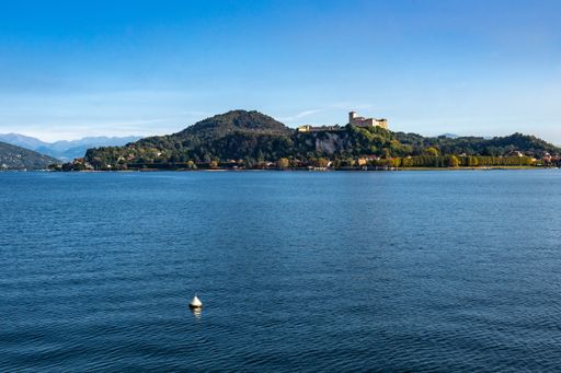 A shot of Borromeo Castle from Arona waterfront on the shores of Lake Maggiore, Piedmont, Italy