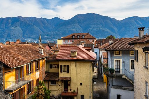 A shot of the cityscape of Locarno with typical colorful houses, a pretty town on the shores of Lake Maggiore, Canton Ticino, Switzerland