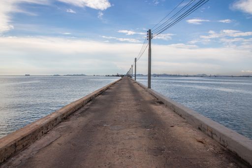 a fisherman's jetty or Pier or bridge right by the sea