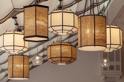 A vertical shot of the interior with chandeliers at hotel Abaama
