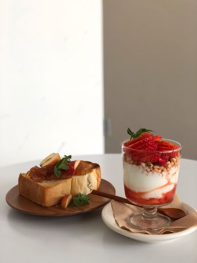 A vertical shot of a dessert and a strawberry smoothie