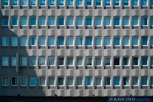 A residential building with a parking site