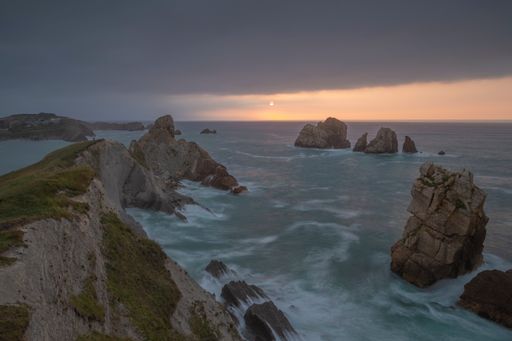 A picturesque seascape in Costa Quebrada, Cantabria, Spain at sunset