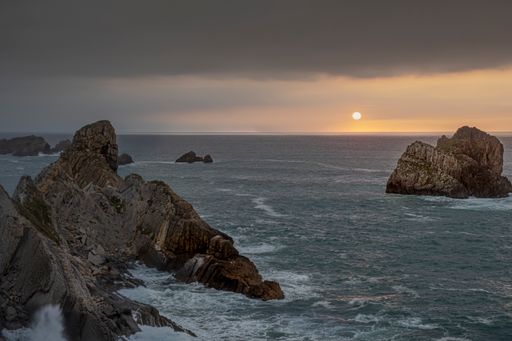 A picturesque seascape in Costa Quebrada, Cantabria, Spain at sunset