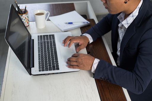 A businessman using his laptop while working at home
