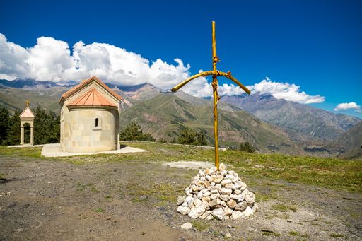 The landscape in Kazbegi: Caucasus mountains and St Ilya Orthodox Church in Stepantsminda, Georgia
