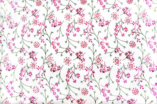A delicate design of red flowers and green stems and leaves on white cotton fabric