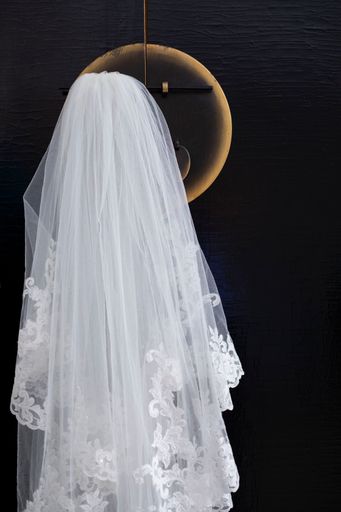 A closeup shot of a wedding dress